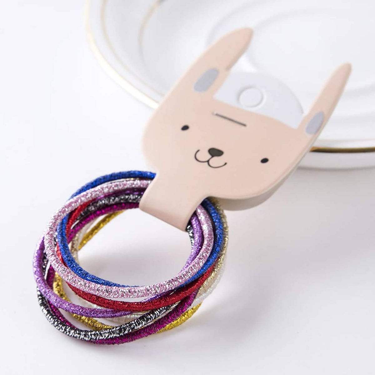 Multi-color glitter hair elastic loops on bunny-shaped holder