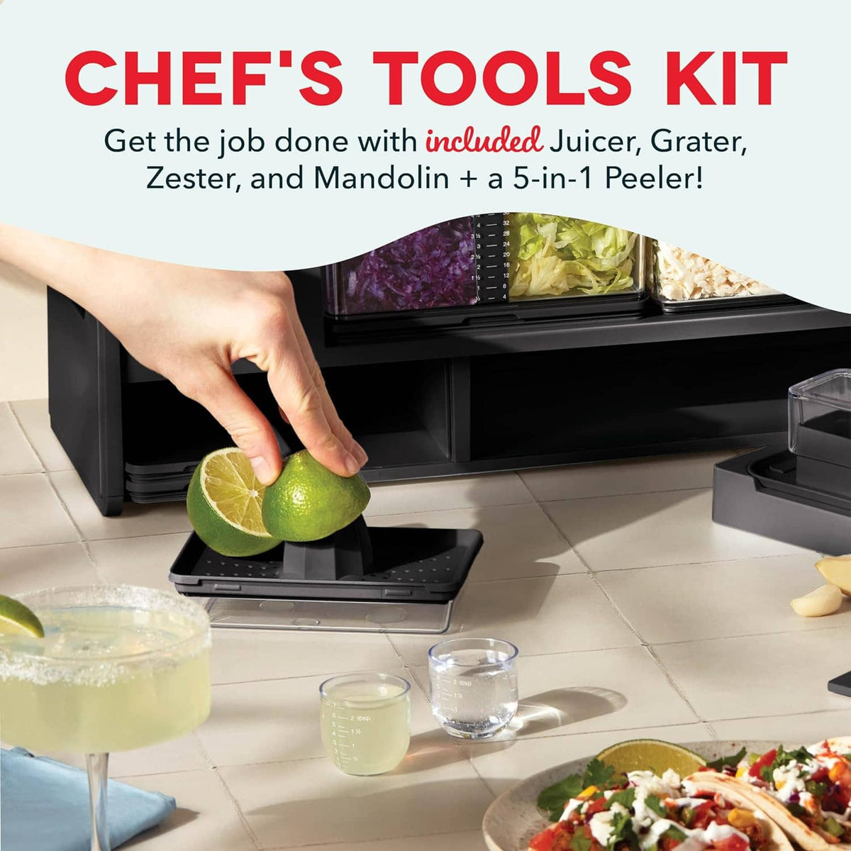 Black recipe prep station with hand pressing a citrus wedge over the trays