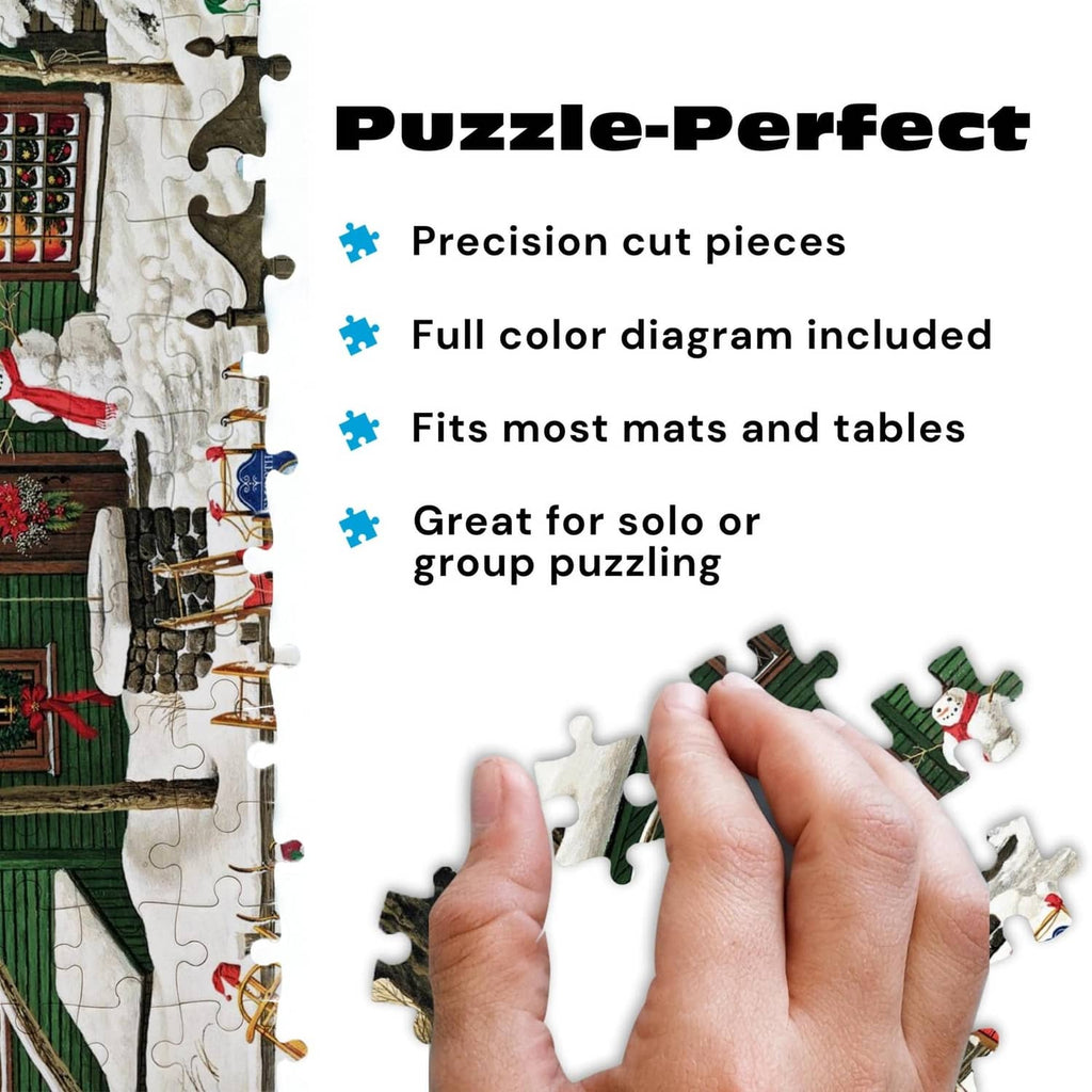 Jigsaw puzzle pieces in a hand over snowy cabin artwork