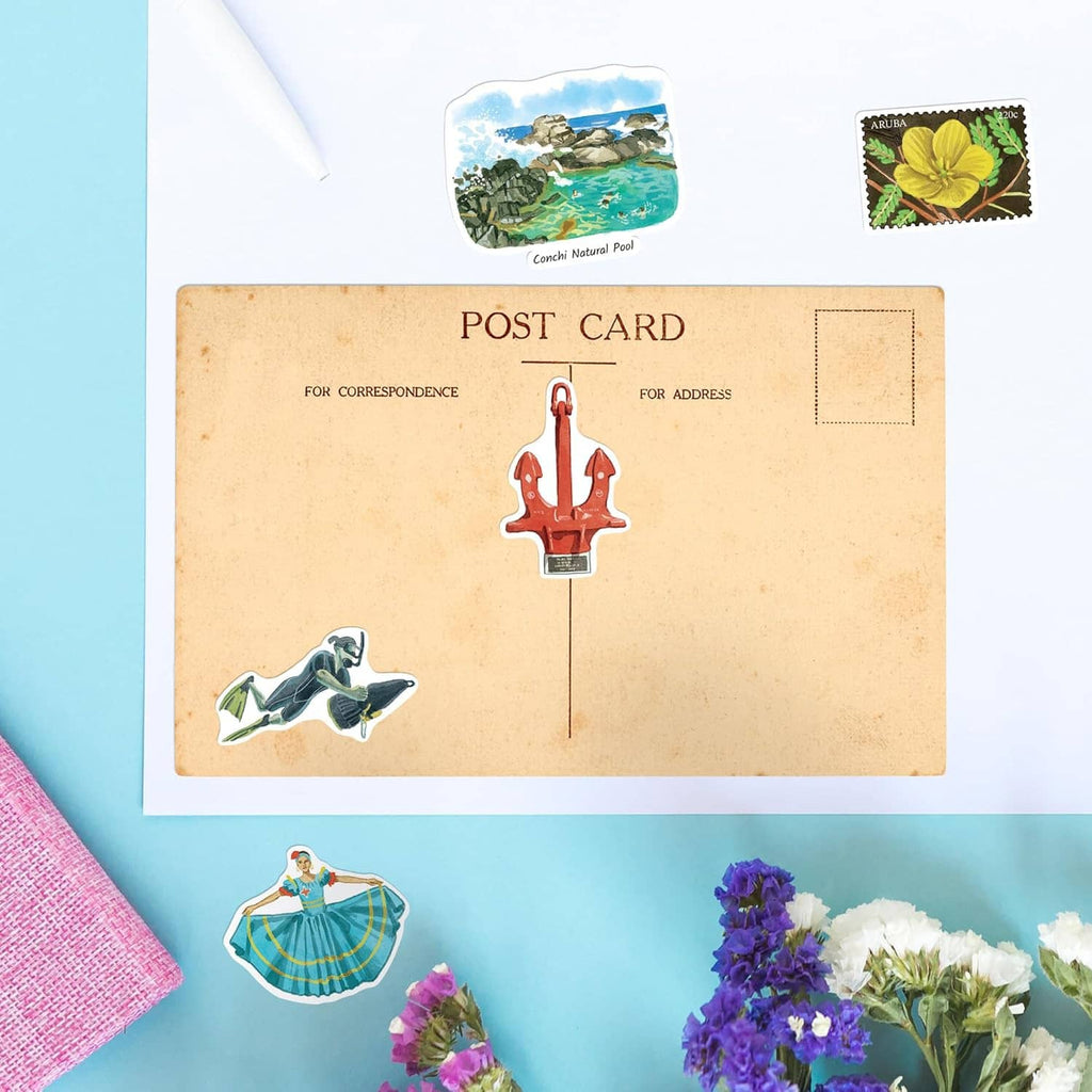 Postcard layout with Aruba stickers, including red lighthouse and sea views