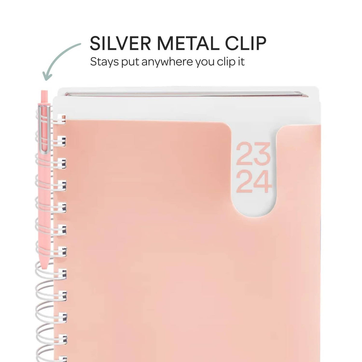Blush pink notebook with silver metal clip and spiral binding