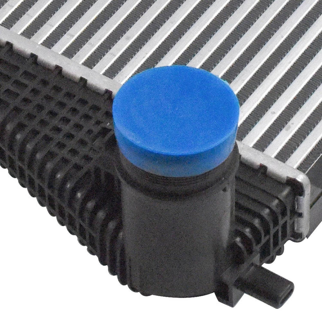 Turbo intercooler charge air cooler close-up of blue cap on black end tank and fittings