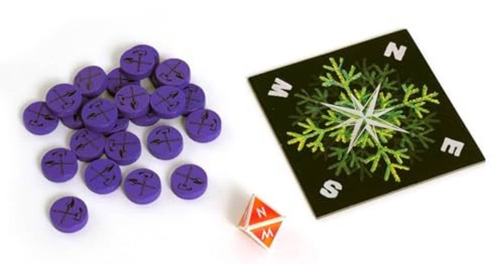 Game tokens and number cards on black board with snowflake design