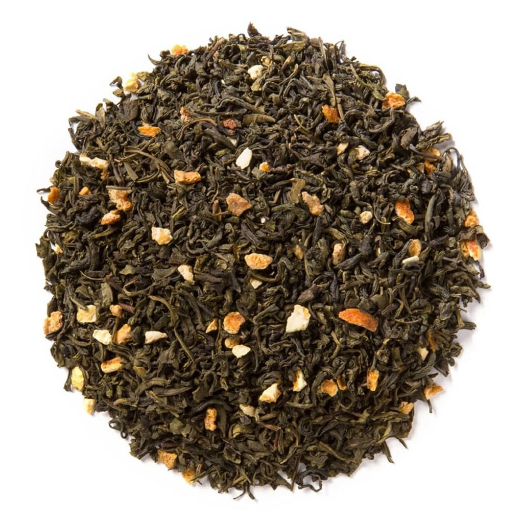 Loose leaf tea blend with dark leaves and visible pale almond and orange pieces