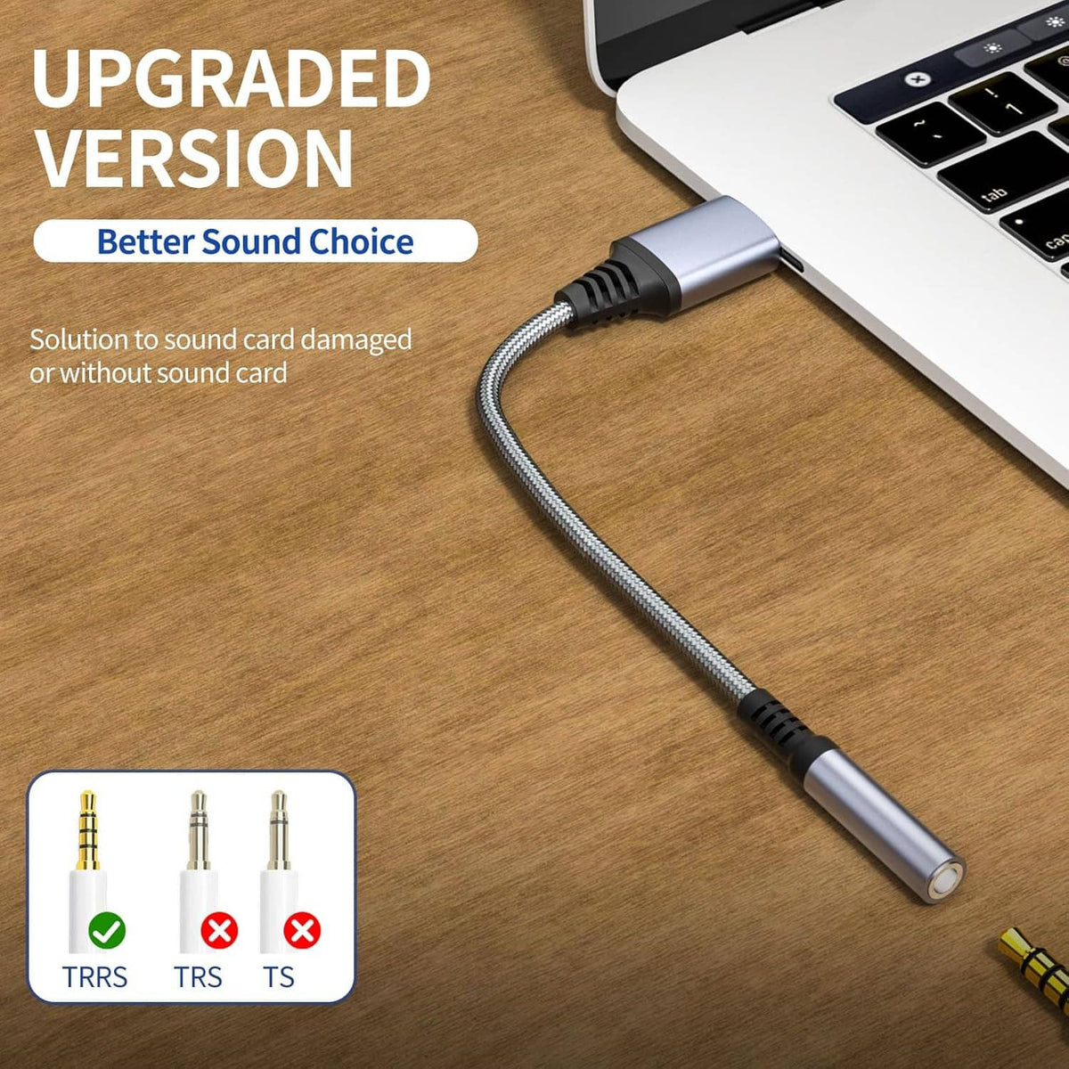 USB audio jack adapter connected to a laptop with 3.5mm plug on braided cable
