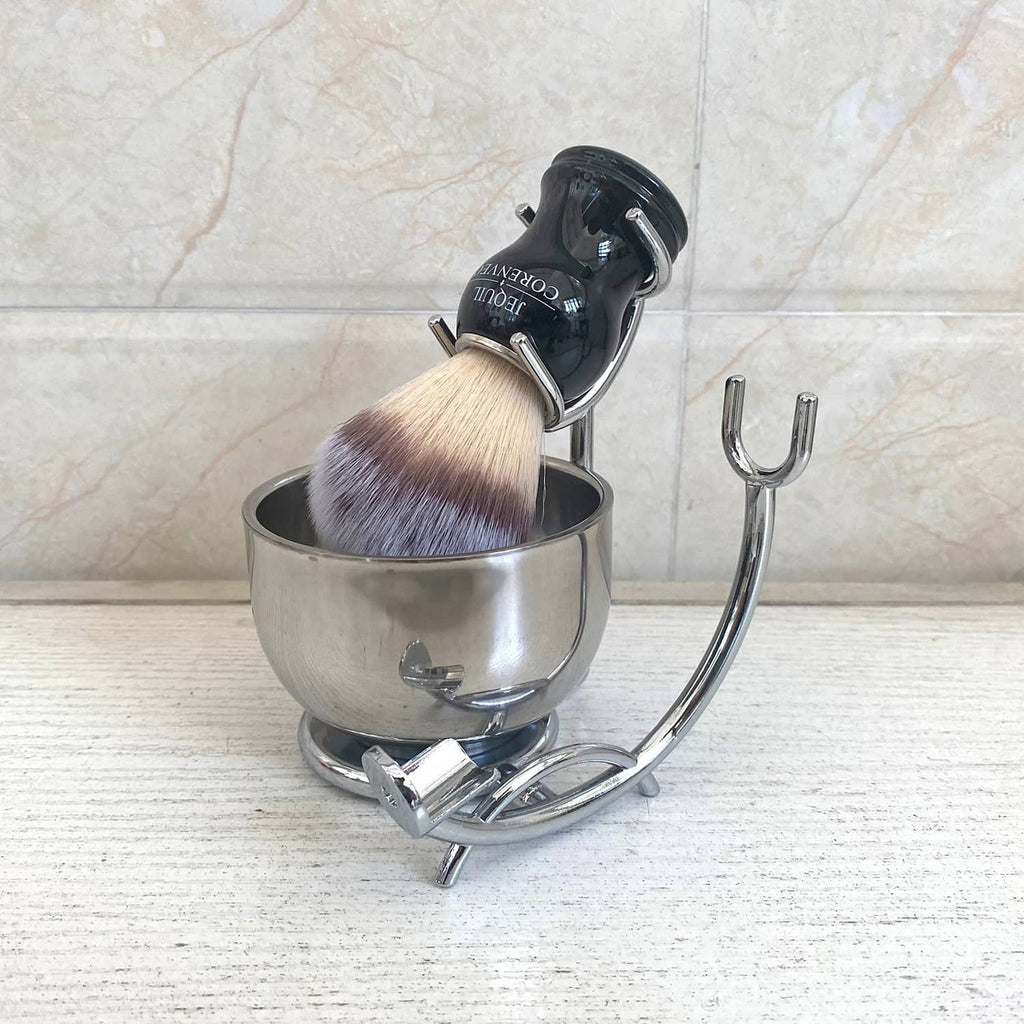 Men's shaving kit with silver bowl, black brush handle, and chrome stand