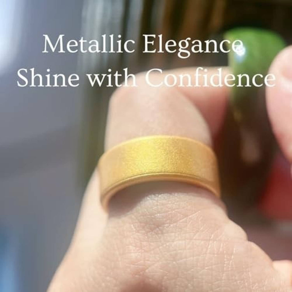 Gold metallic silicone ring cover on fingertip, close-up view.