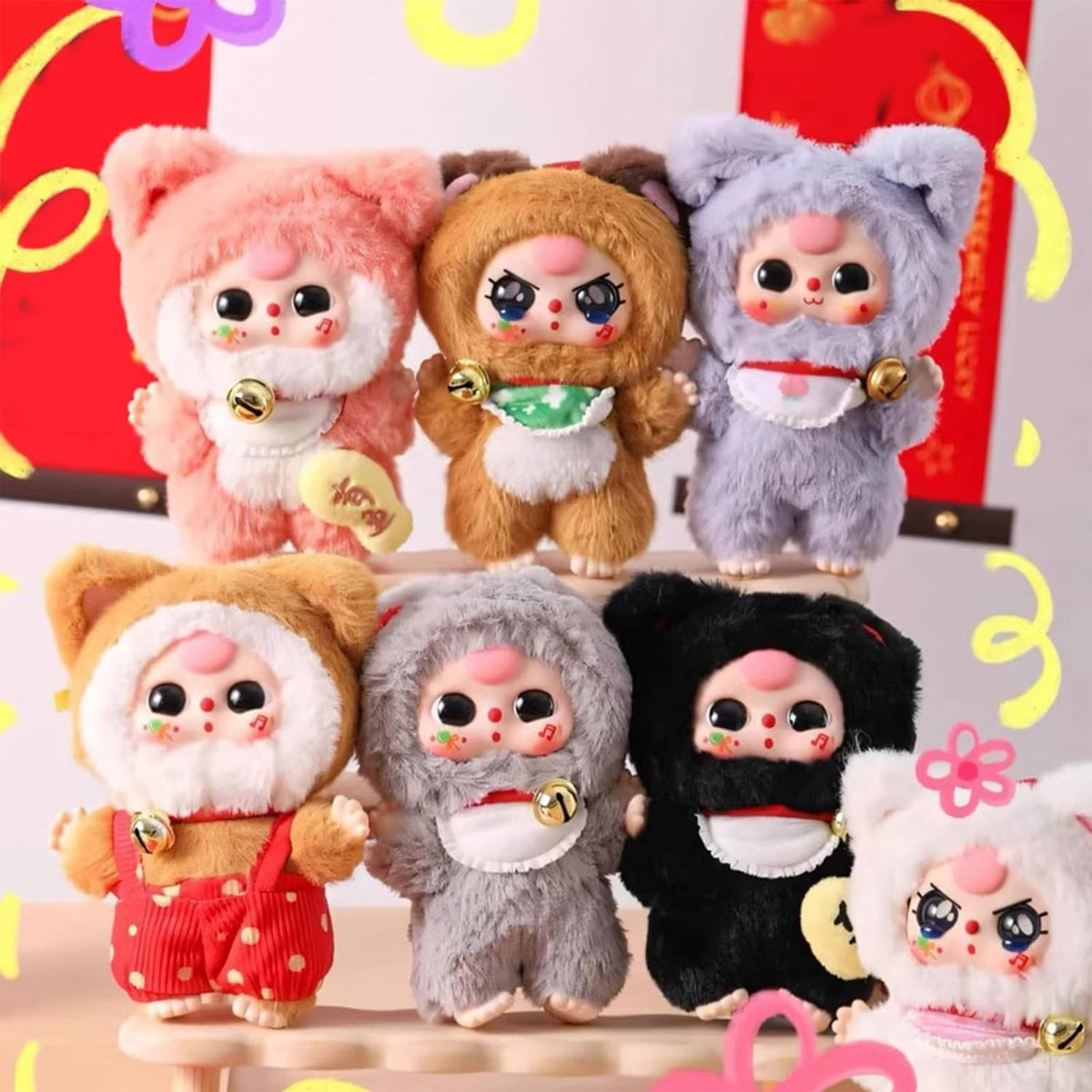 Set of six small plush cat dolls with bell charms, in pink, tan, gray, and black.