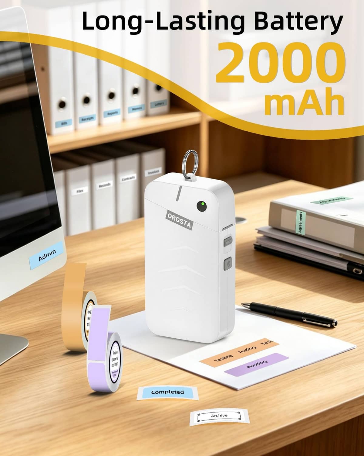 White ORGSTA label maker with tape roll on tabletop with stationery