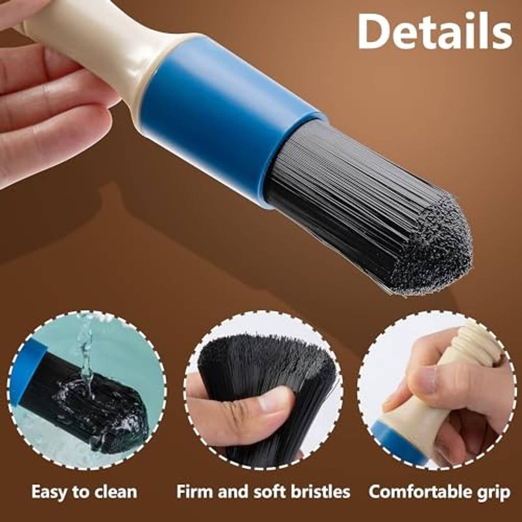 Close-up of blue handle cleaning brush with dense black bristle head and hose