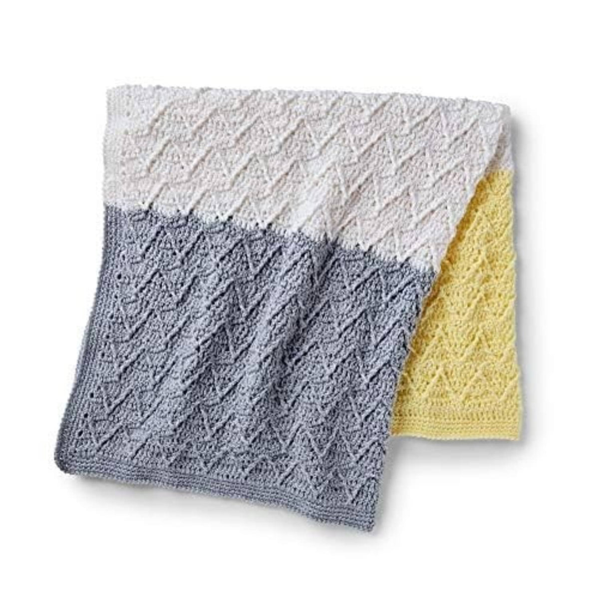 Two-tone knitted baby blanket swatch: textured cream and dark gray with yellow edge