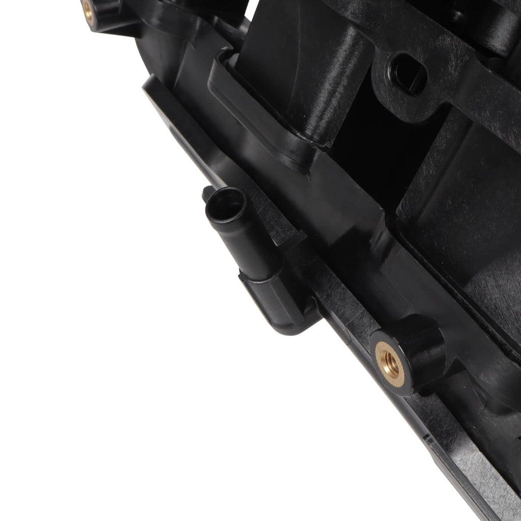 Air intake manifold close-up of black housing edge with small outlet tube