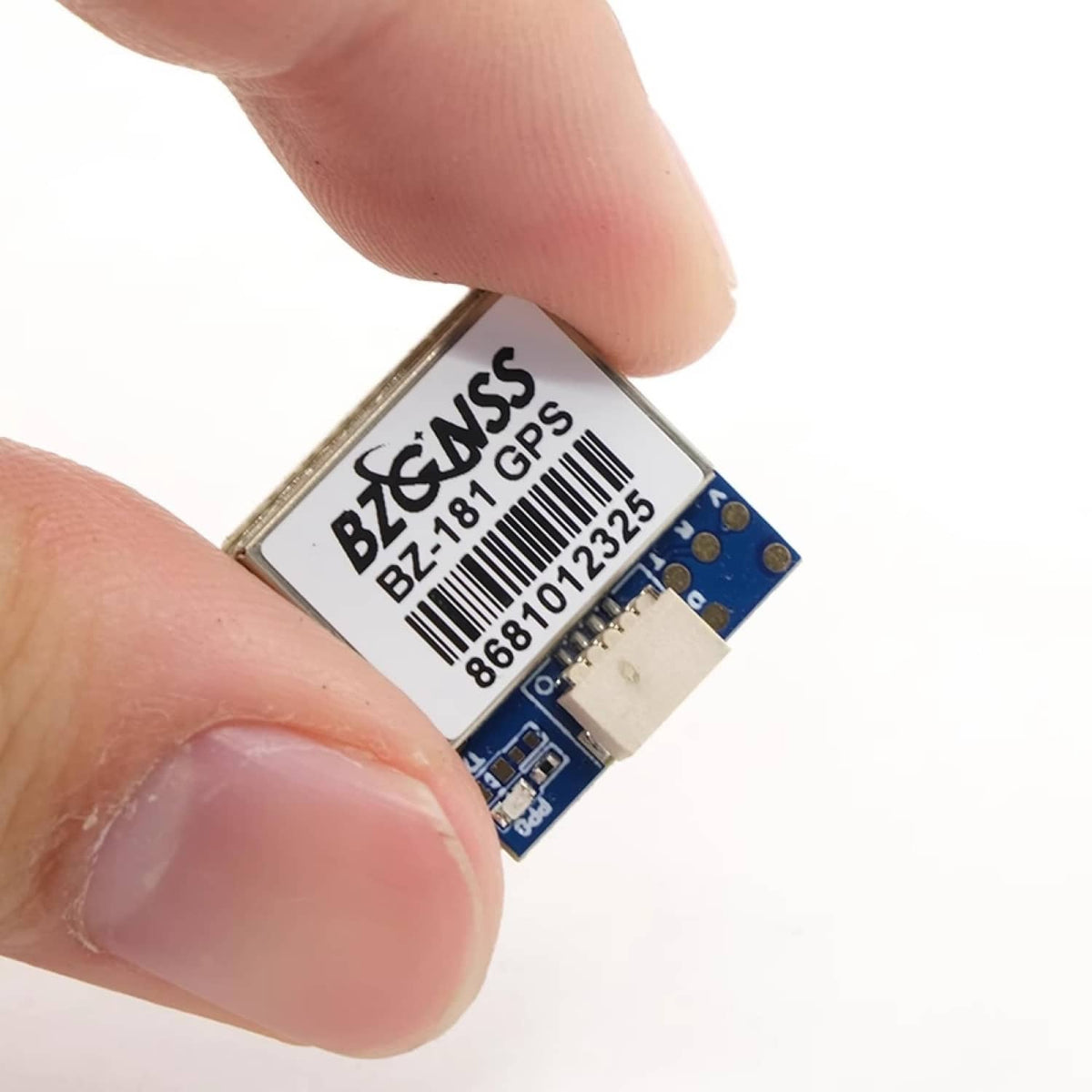 GPS module close-up with fingers holding the board and label