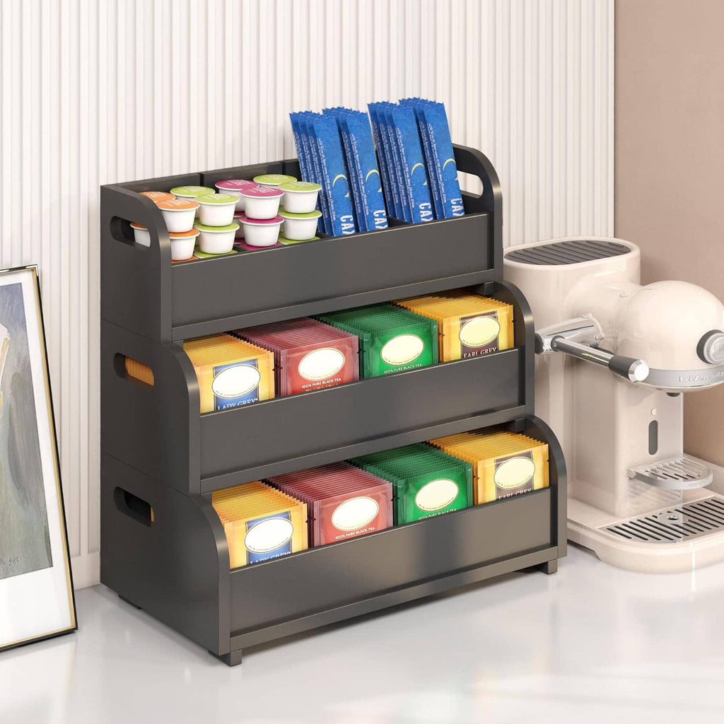 Black 3-tier tea bag organizer with tea packets on top and open shelves below