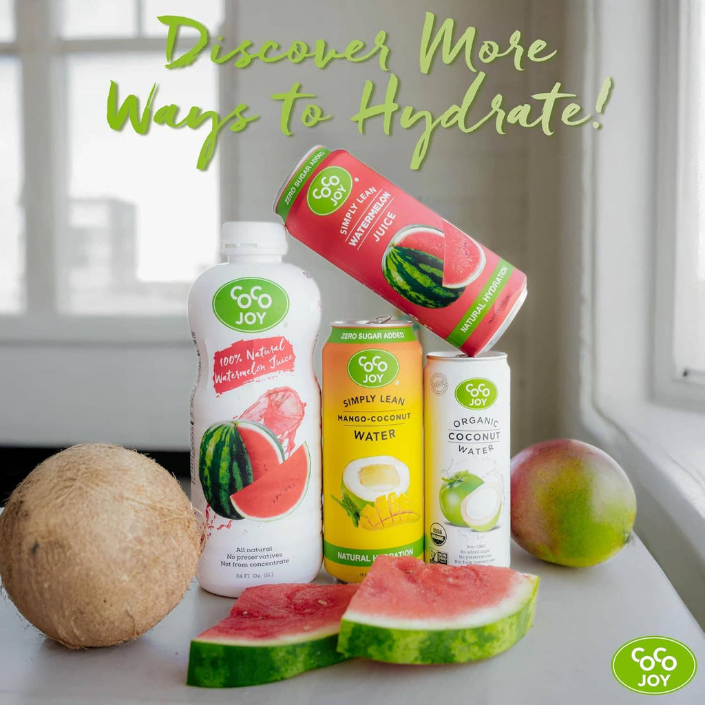 Assorted Coco Joy drink cans including watermelon juice, plus fruit slices