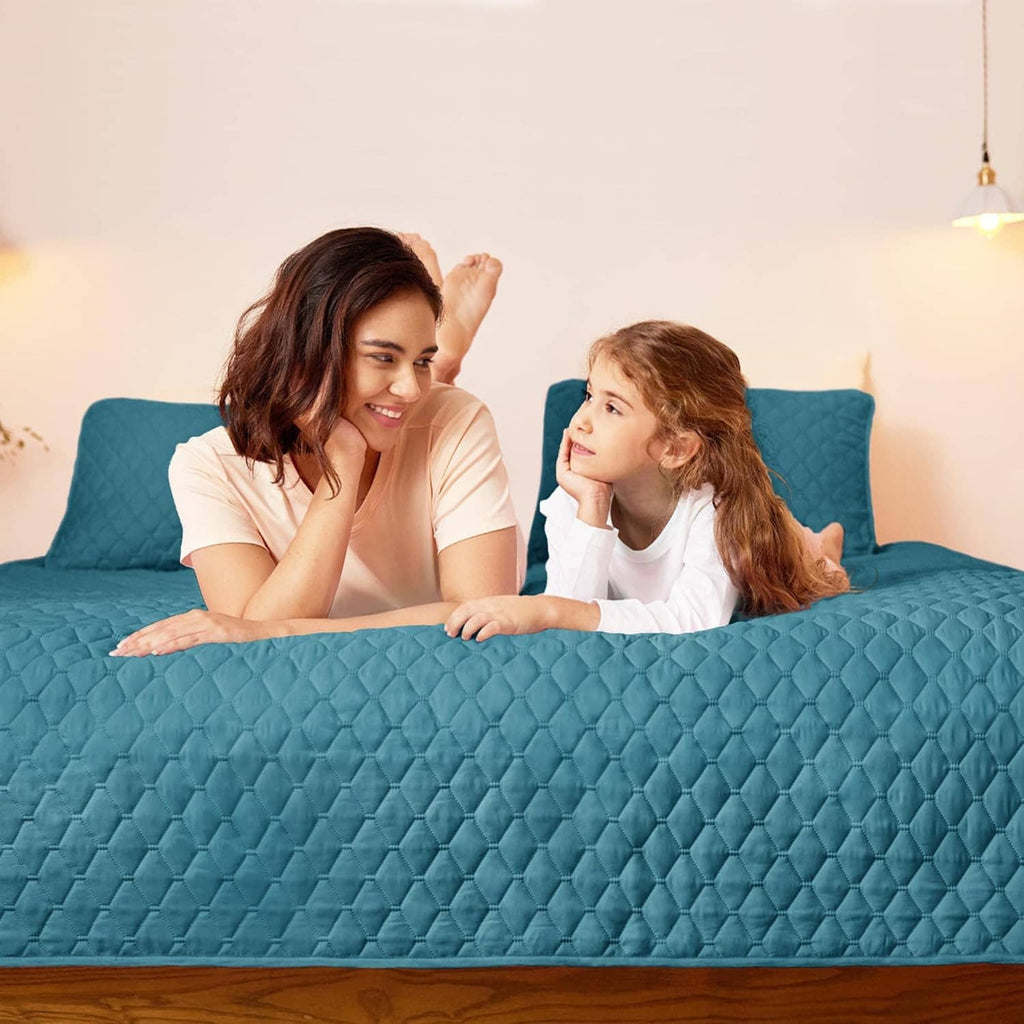 Teal quilt bedding with raised diamond quilting and two matching pillow shams
