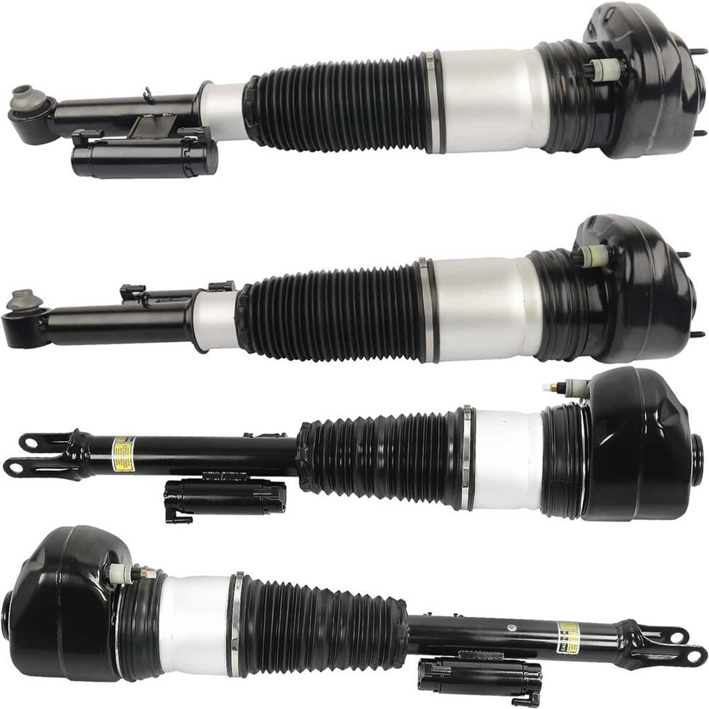 Three air suspension struts with black caps, white cylinders, and coiled spring sleeves
