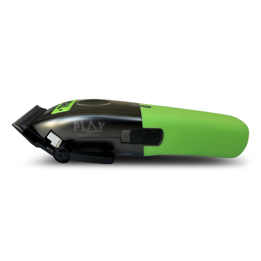 Men's hair clipper lying sideways, green and black body with trimmer blade