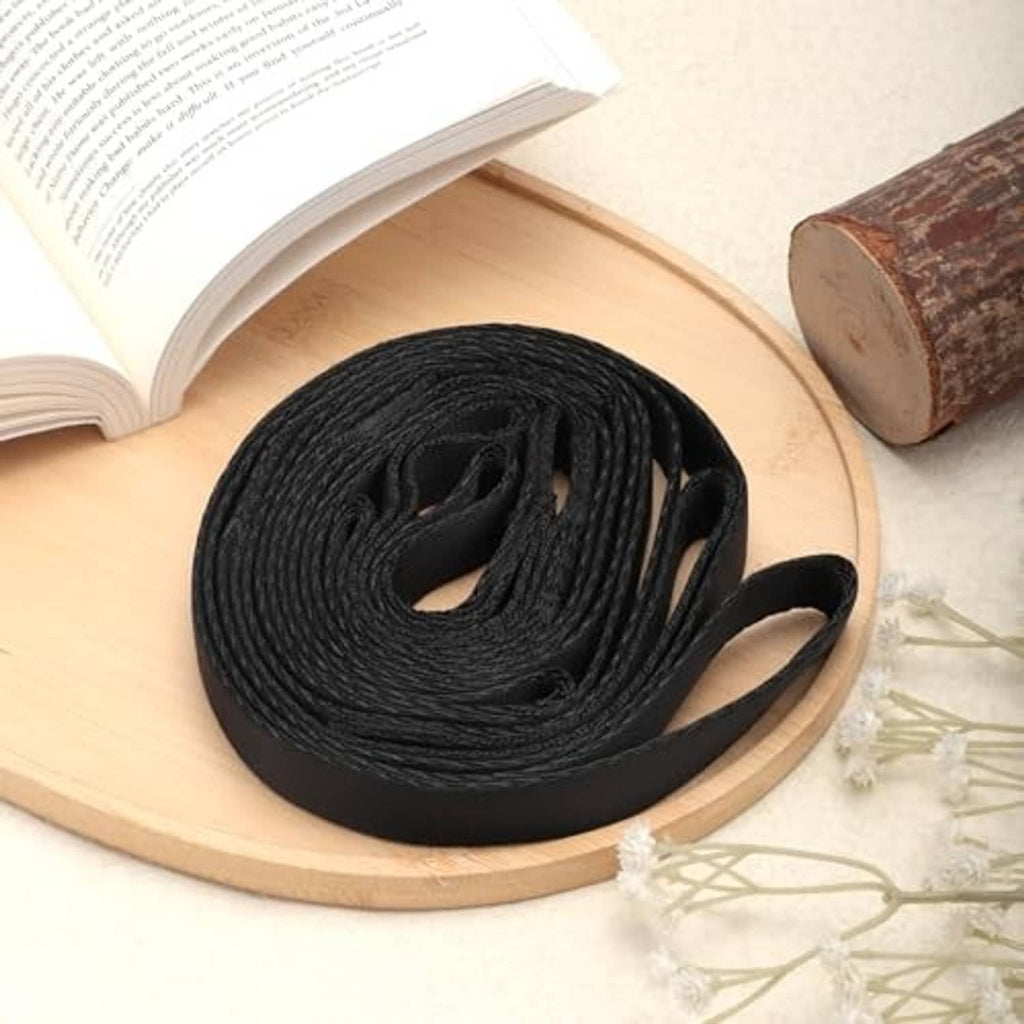 Rolled black climbing aider strap with two loops, compact portable hunting and climbing aid