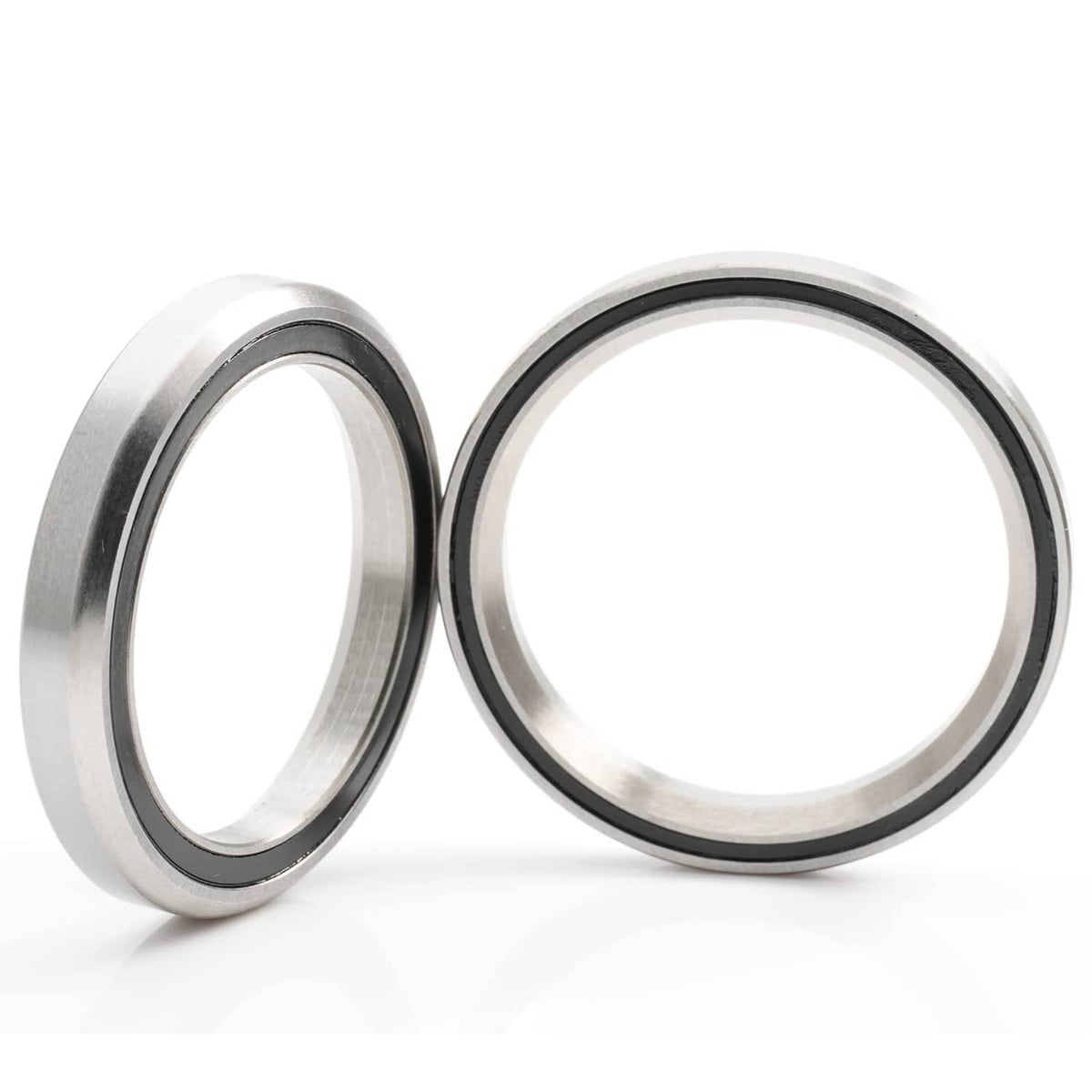 Bike headset bearing pair, side-by-side metal rings with black inner rim