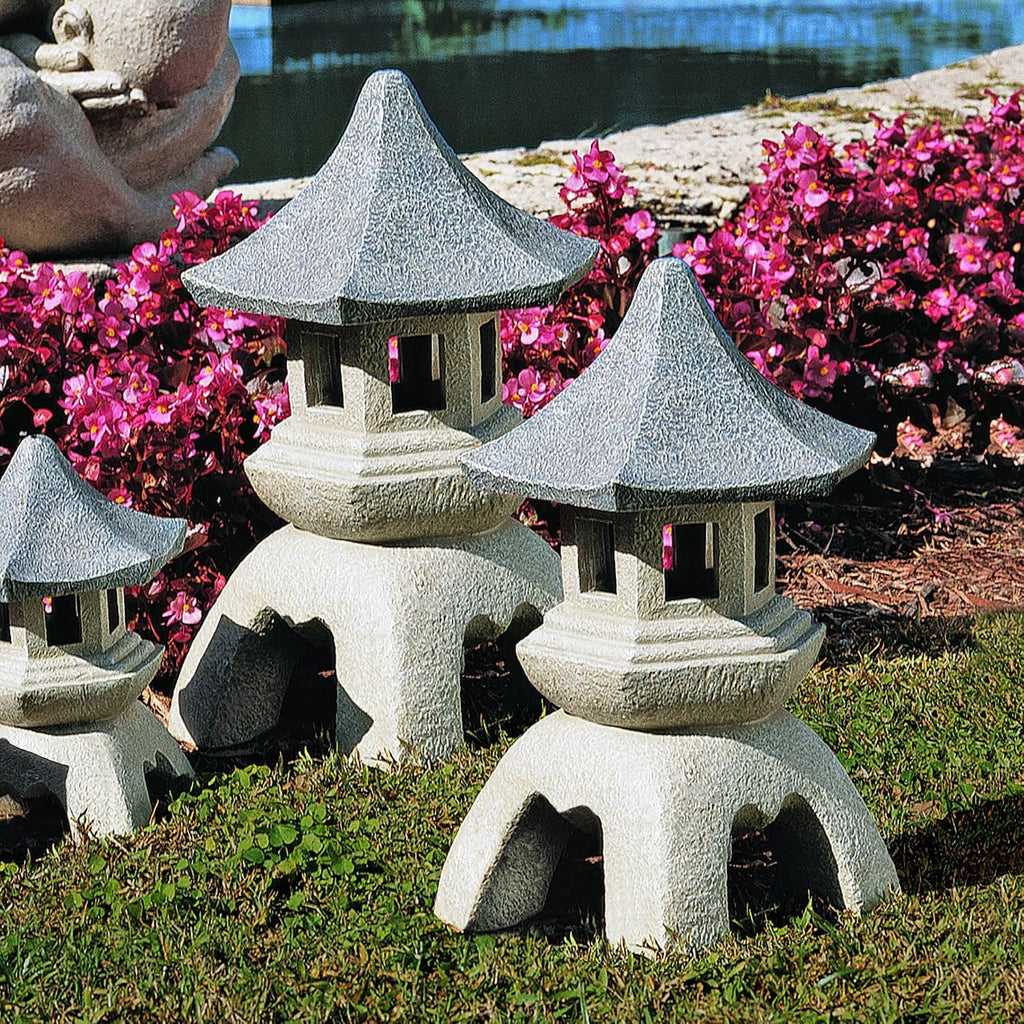 Set of 2 large cast stone pagoda lantern statues with dark roof caps and lit window openings