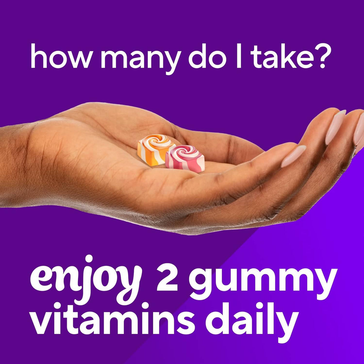 Hand holding two spiral gummies for a calcium supplement serving.