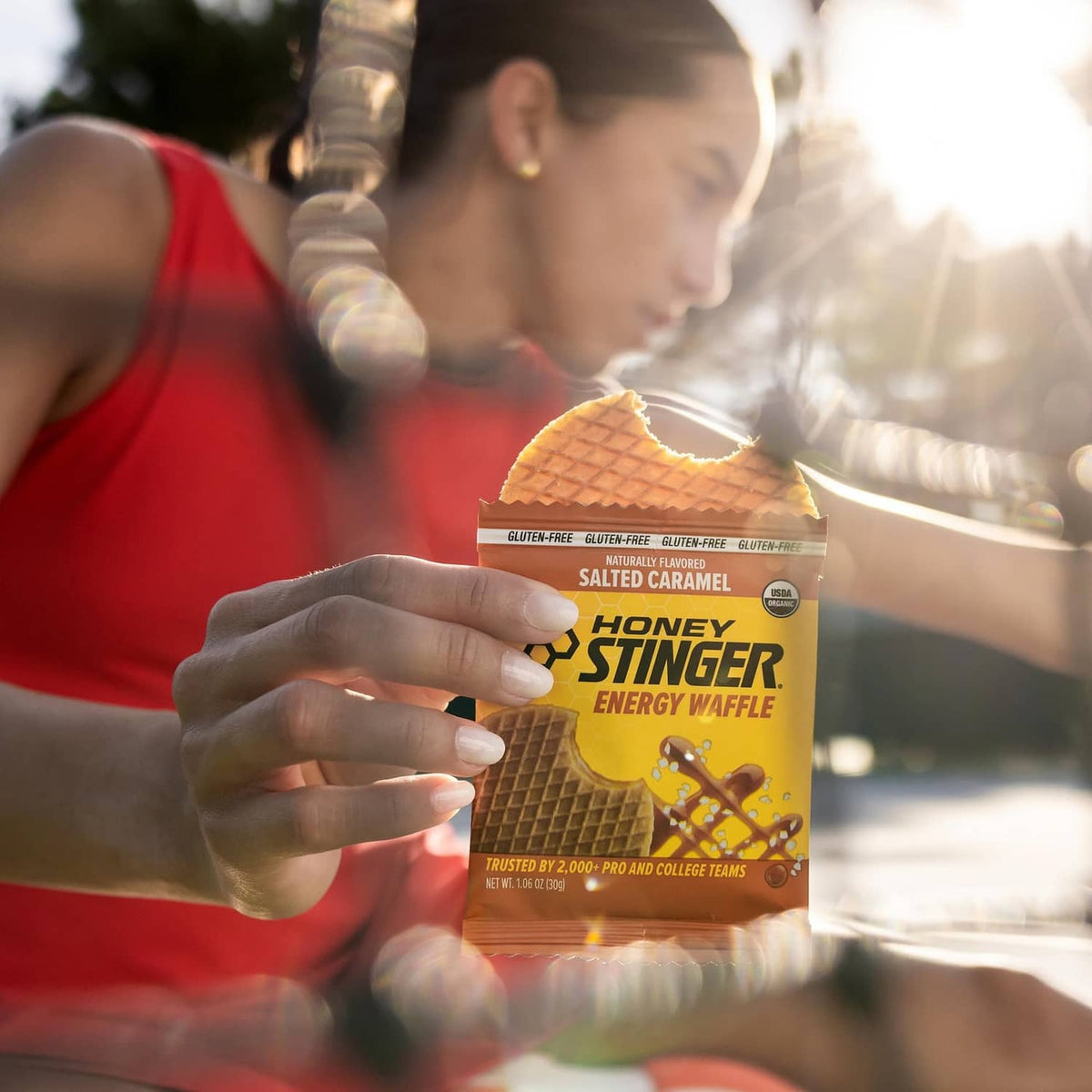 Salted caramel gluten-free energy waffle pack held by a runner
