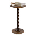 Rustic brown round side table with turned pedestal base, with cup and book on top