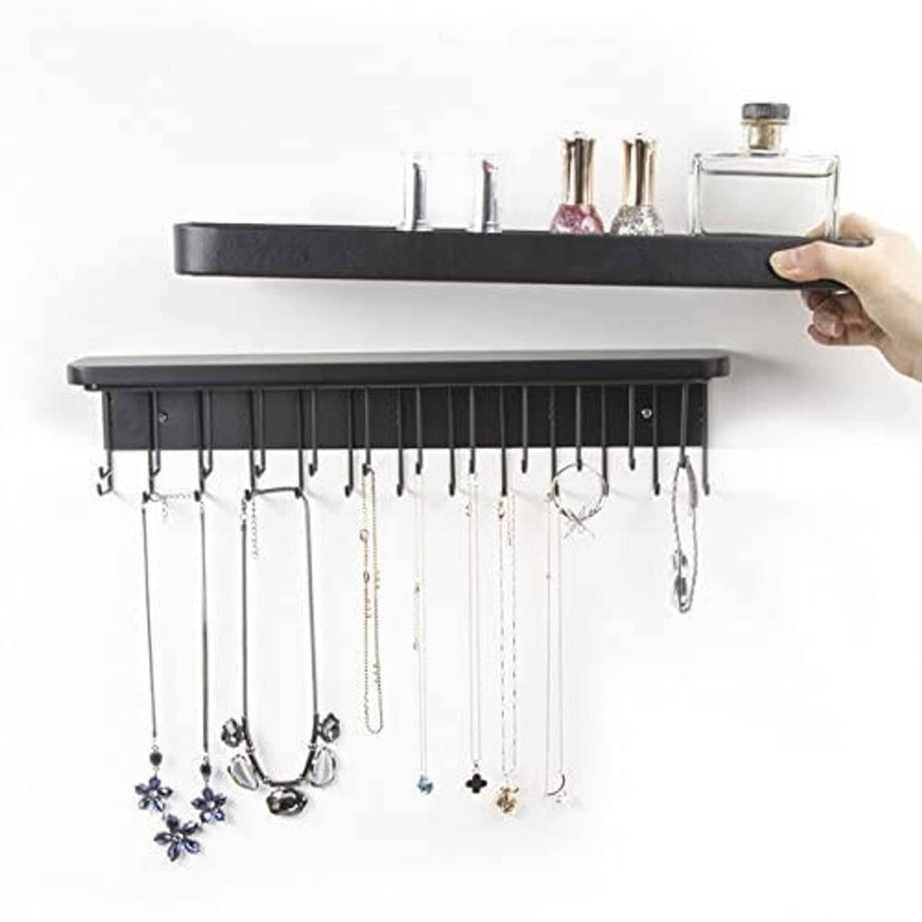 Black wall necklace organizer with wide top bar and metal hooks for chains