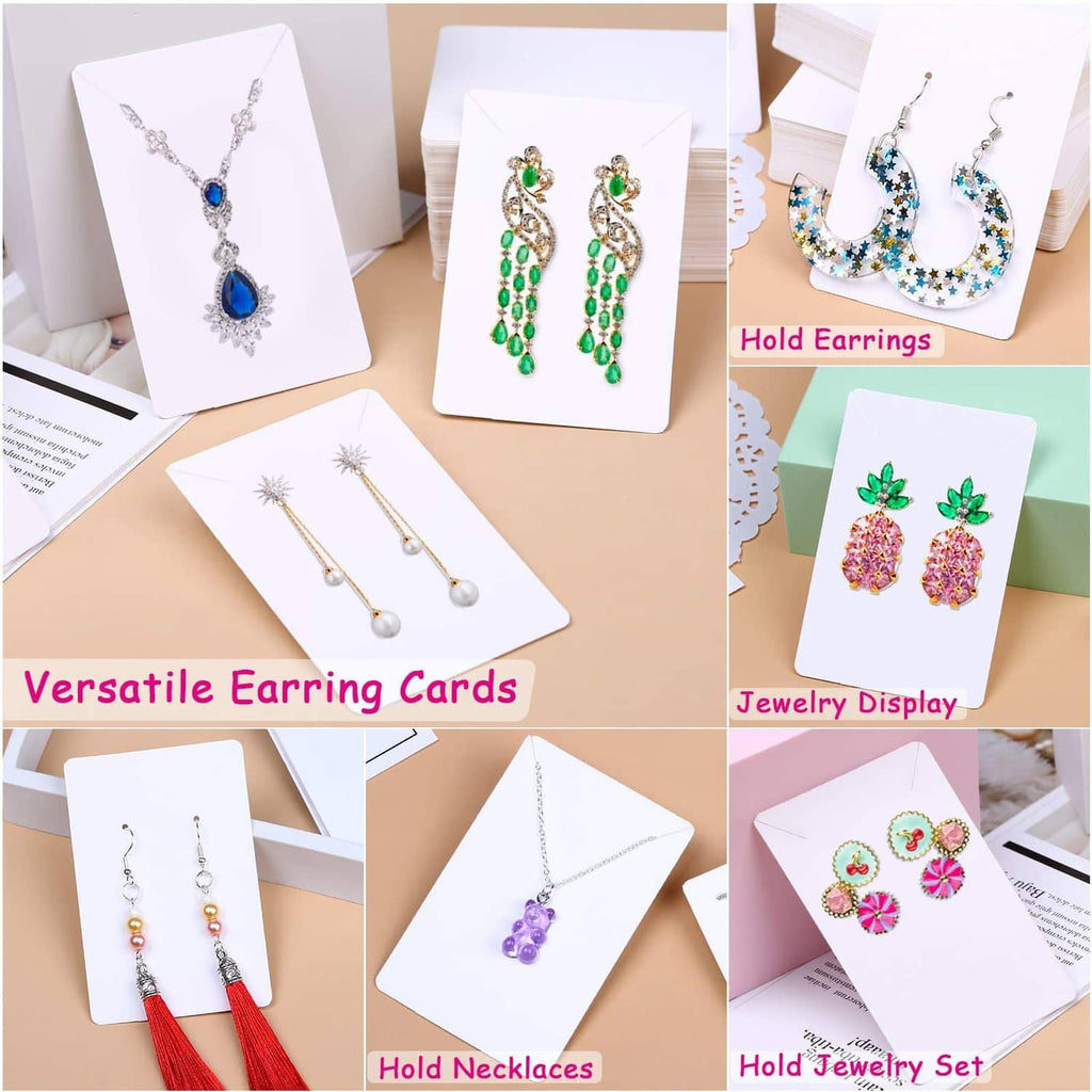 White earring display cards showing hanging earrings and stud designs