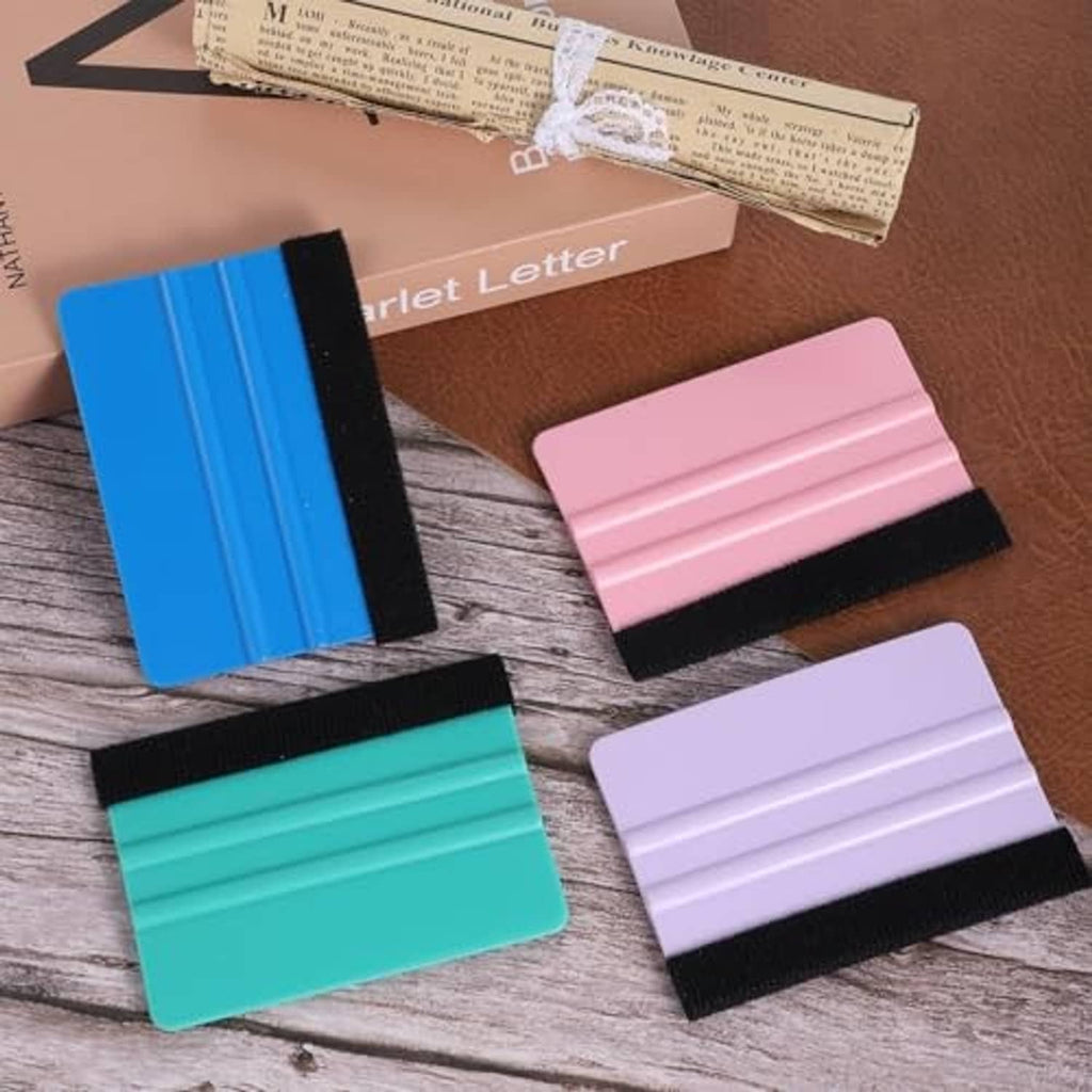 Four felt squeegee tools with black straps in blue, teal, purple, and pink