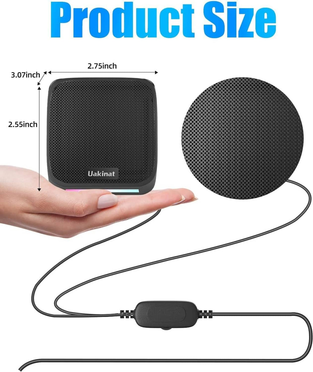 Compact black Uakinat speaker with cable, shown in hand for size