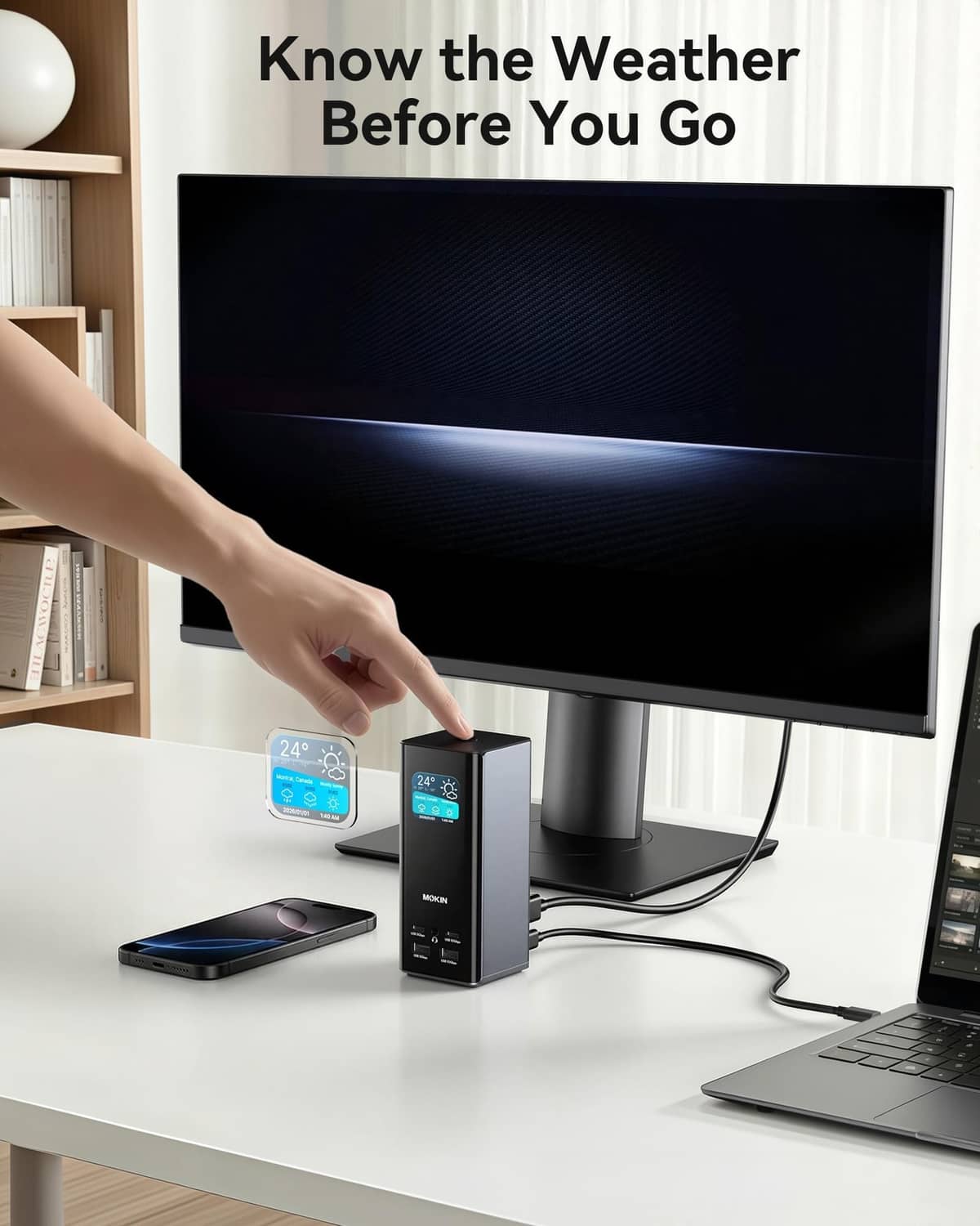 USB-C docking station on desk with connected phone, compact black device with display window