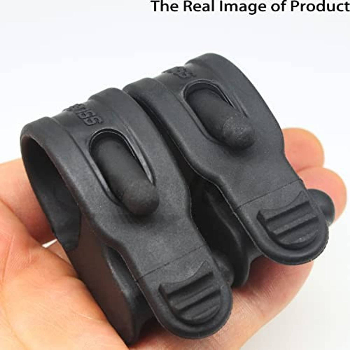 Black throttle assist grip pair held in hand, showing clamp band and lever shape.