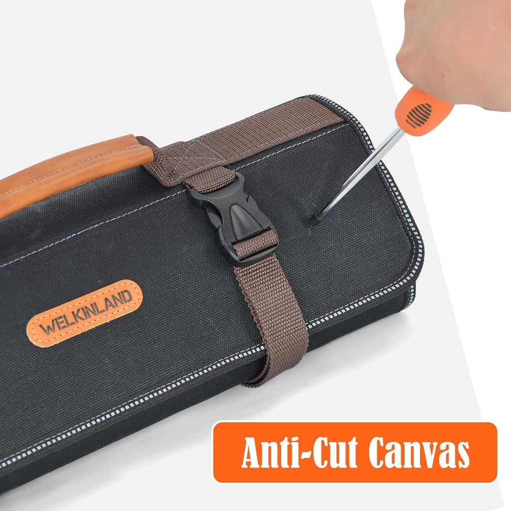 Black waxed canvas tool roll with brown webbing handle and quick-release buckle