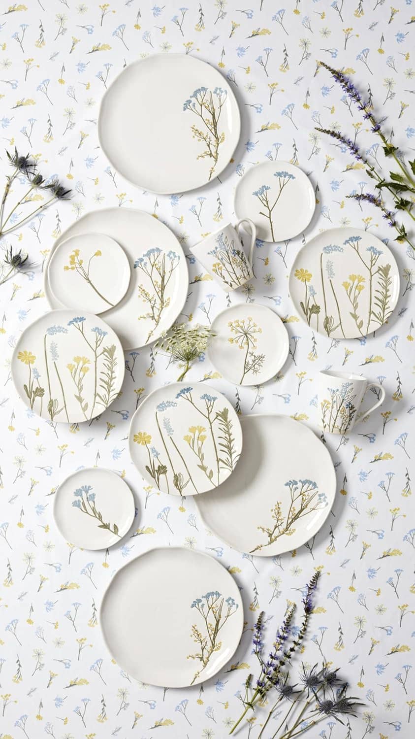 Assorted wildflower appetizer plates, white with botanical stem prints in blue and gold