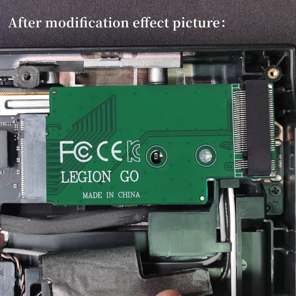 Green PCB adapter board inside handheld, showing Legion Go markings