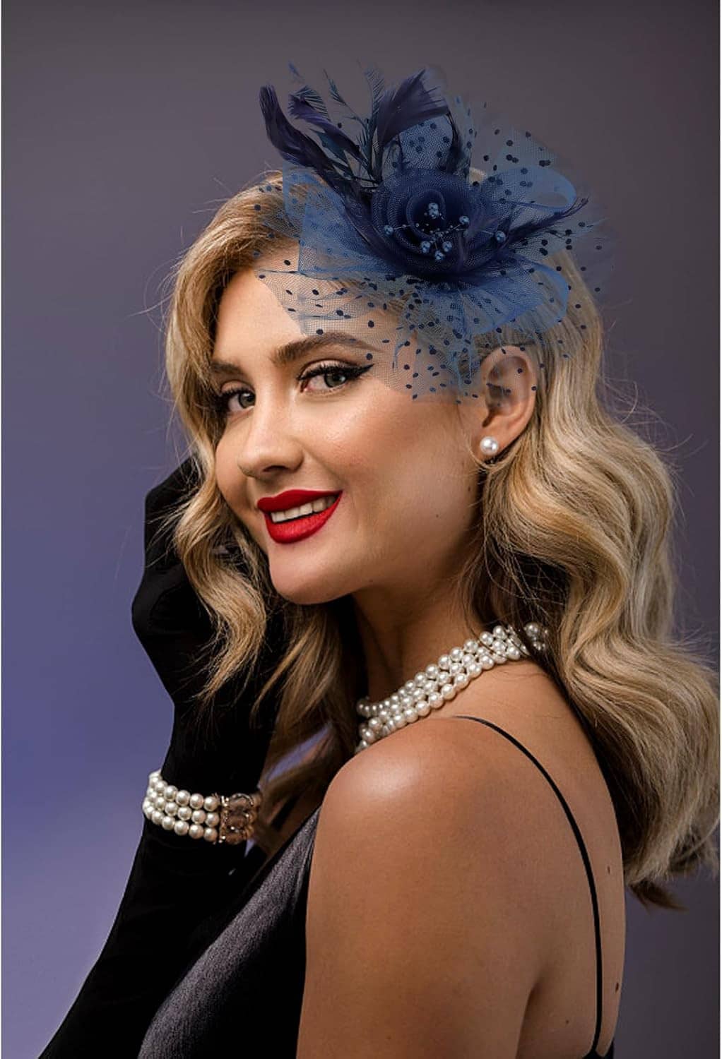 Navy feathered fascinator with polka-dot tulle flower and faux pearl embellishment