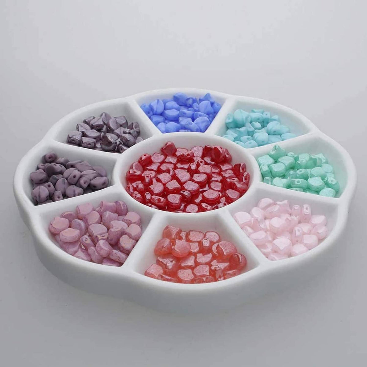 White ceramic 9-well watercolor palette filled with multicolor paint