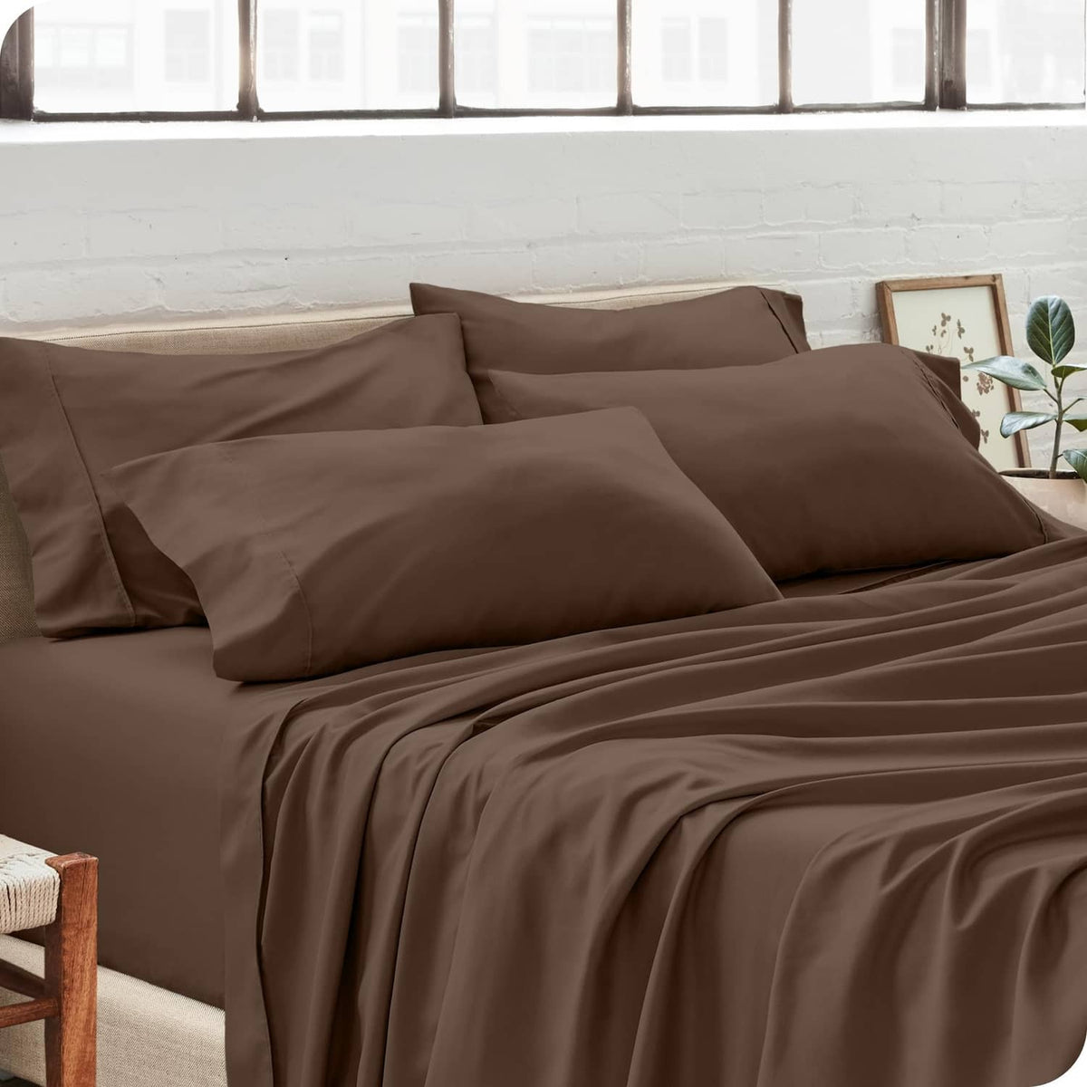Cocoa brown pillowcases on bed with multiple stacked pillows, standard size
