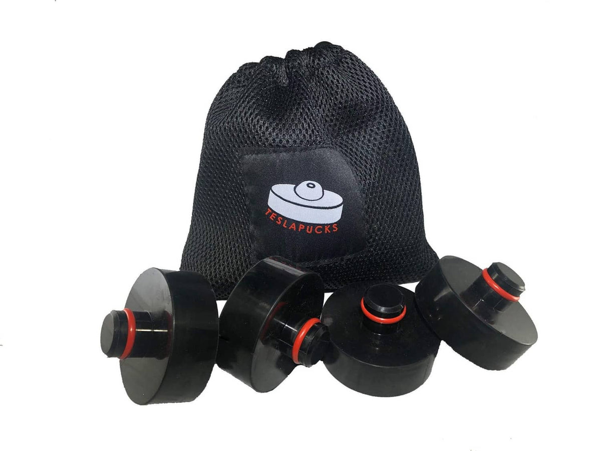 4 black lifting jack pads with red accents in black storage pouch