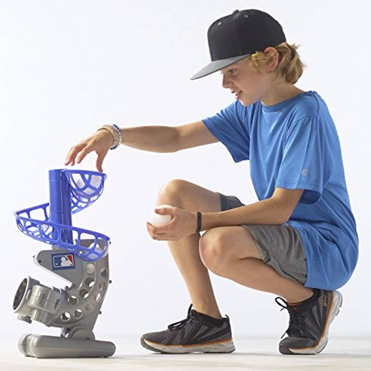 Blue and gray electronic baseball pitching machine with ball launcher and blue cage