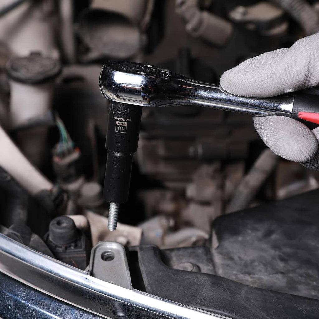 3/8 in impact socket on an engine bolt with chrome ratchet wrench