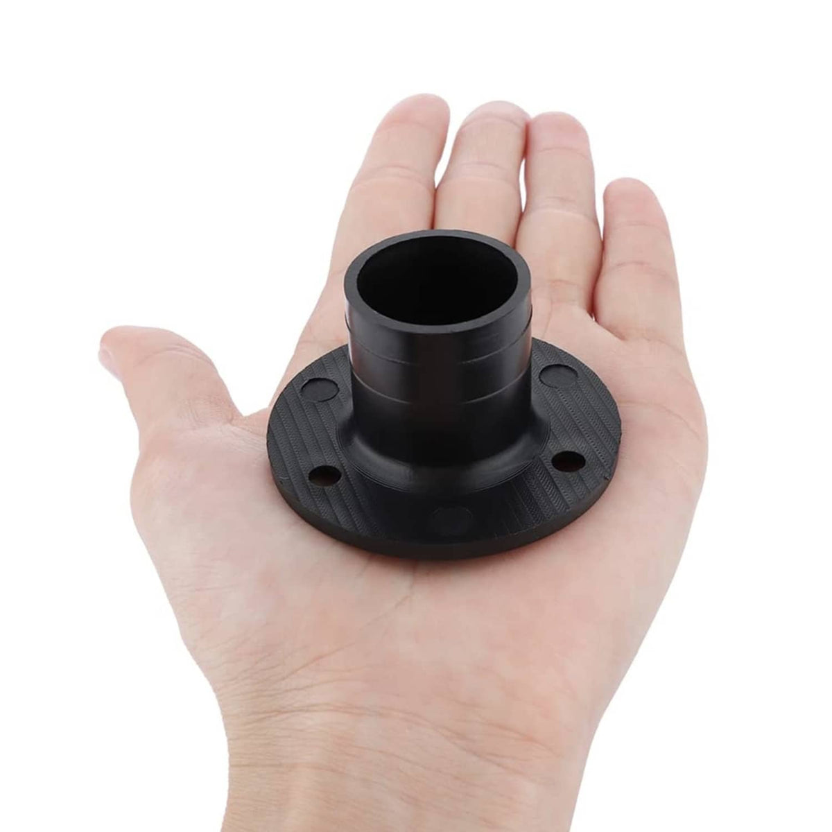 Black nylon deck floor drain fitting held in hand, round base with slotted grate