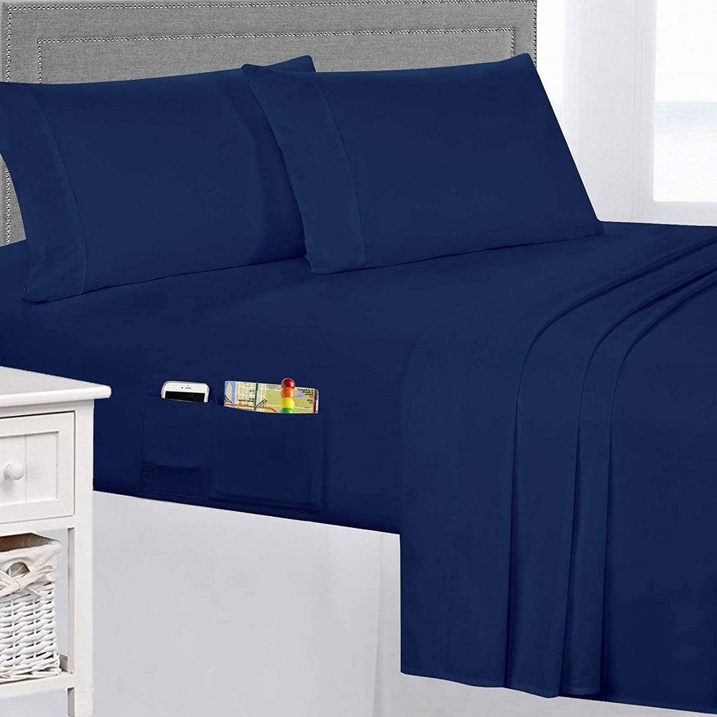 Navy queen sheet set close-up: pillowcase and fitted/flat sheet with smooth seams.