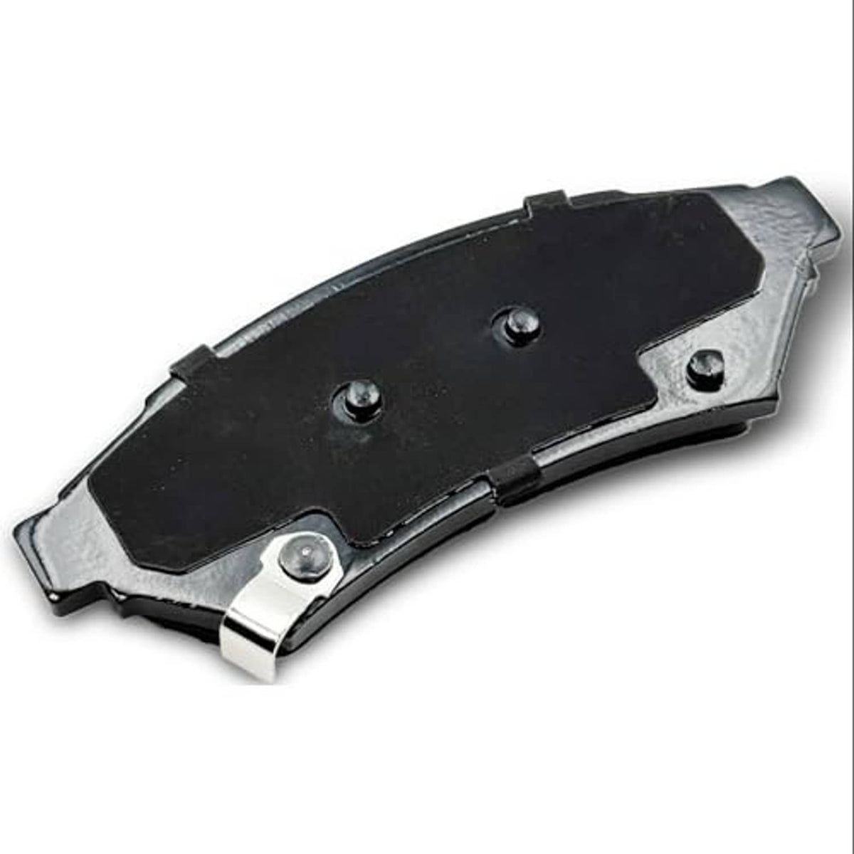 Rear side of ceramic brake pad, black metal backing with mounting holes and clips.
