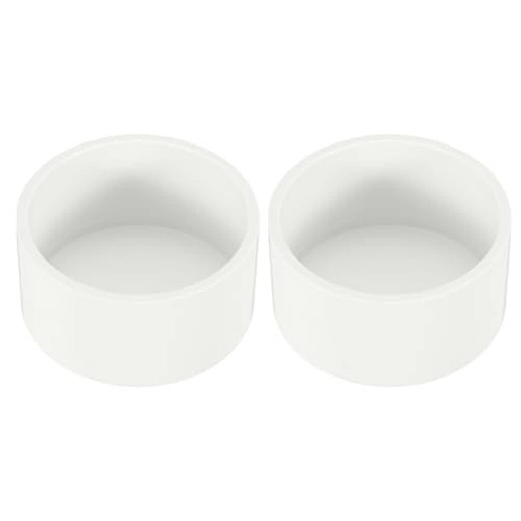 White PVC pipe end cap plug set, open-ended round cylinder fittings.