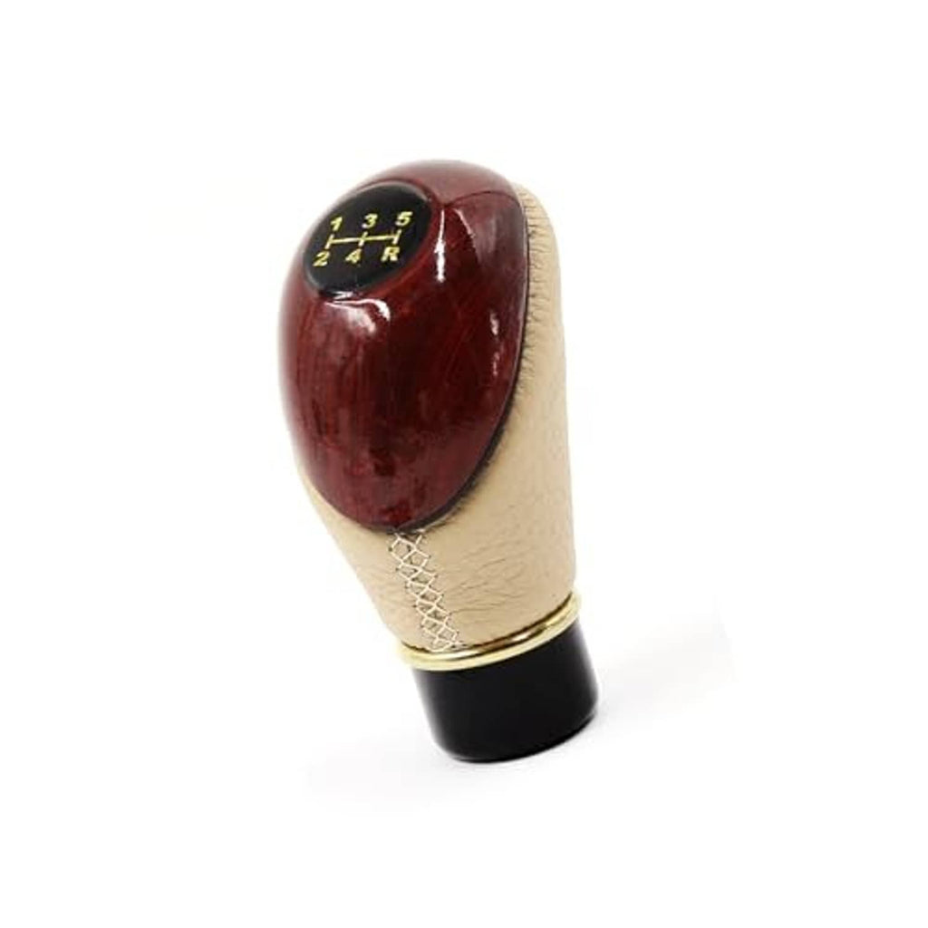 Brown top manual gear shift knob with 5-speed number markings, beige sides