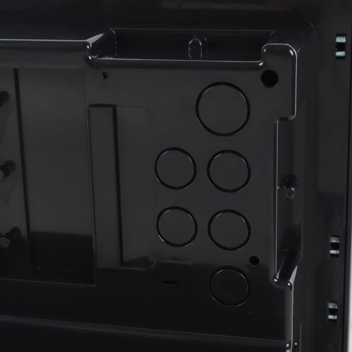 Black mounting bracket plate with circular holes on power converter housing