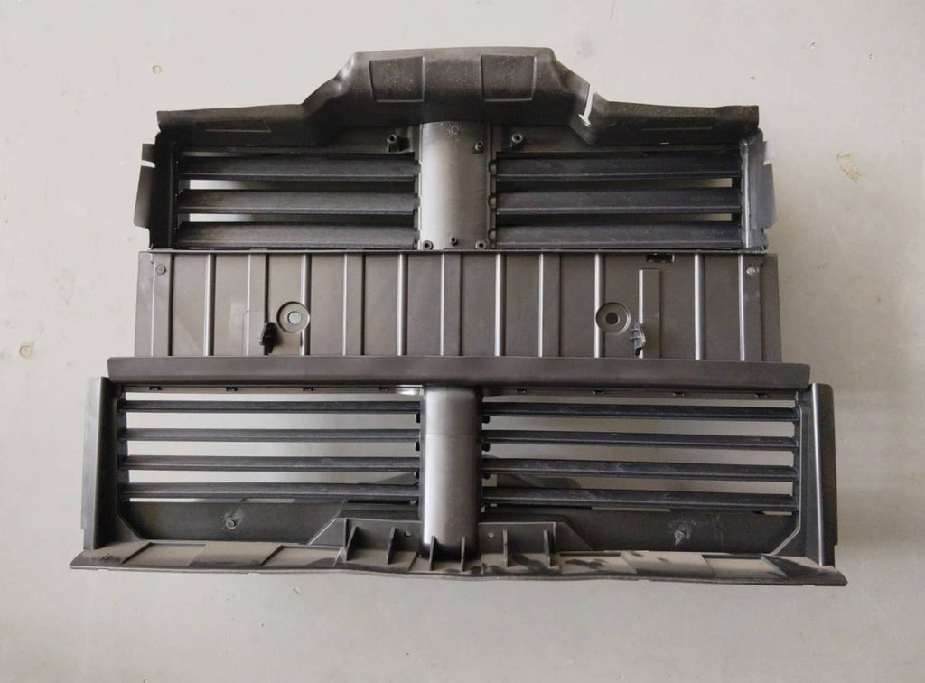 Black radiator shutter control assembly with two shutter halves and horizontal slats